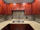 Close up on the kitchen sink, showcasing granite countertops and sleek cabinets at 750 Island Way # 101, Clearwater Beach, FL 33767