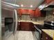 Updated kitchen with stainless steel appliances and granite countertops for style and function at 750 Island Way # 101, Clearwater Beach, FL 33767