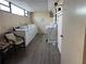 Community laundry room with multiple washing machines and a folding table at 750 Island Way # 101, Clearwater Beach, FL 33767