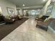 Neutral building lobby with four chairs, tile floors, and a view of the elevators at 750 Island Way # 101, Clearwater Beach, FL 33767