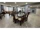 Spacious community meeting room with tables, seating, neutral colors, and tile floors at 750 Island Way # 101, Clearwater Beach, FL 33767