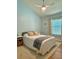 Comfortable bedroom featuring a neutral color scheme, plush rug, and a bright window at 7543 Red Mill Circle Cir, New Port Richey, FL 34653