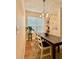 Well-lit dining area with a wooden table and hardwood floors at 7543 Red Mill Circle Cir, New Port Richey, FL 34653