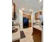 Well-lit kitchen with wood cabinets, stainless steel sink, and a black refrigerator at 7543 Red Mill Circle Cir, New Port Richey, FL 34653