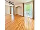 Spacious living room with hardwood floors and sliding glass doors at 7543 Red Mill Circle Cir, New Port Richey, FL 34653
