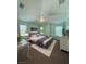 Staged bedroom features a king bed, ceiling fan and two windows for natural light at 7543 Red Mill Circle Cir, New Port Richey, FL 34653