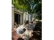 Brick paved patio with outdoor seating and shade trees offers a relaxing outdoor living space at 7543 Red Mill Circle Cir, New Port Richey, FL 34653