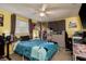 Unique bedroom featuring yellow walls, gamer decor, and ample display shelving at 7901 Marlboro Dr, Port Richey, FL 34668