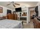 Comfortable bedroom featuring mirrored closet doors and views to an office area at 7901 Marlboro Dr, Port Richey, FL 34668