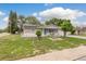 Charming single-story home featuring a well-maintained lawn with beautiful landscaping and a two-car garage at 7901 Marlboro Dr, Port Richey, FL 34668