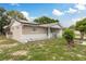 Charming single-story home featuring a well-maintained lawn with beautiful landscaping at 7901 Marlboro Dr, Port Richey, FL 34668