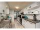 Well-lit kitchen featuring white cabinets, modern appliances, and durable countertops, perfect for everyday cooking at 7901 Marlboro Dr, Port Richey, FL 34668