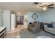 View of an open concept living area leading to a kitchen and dining space, promoting a social atmosphere at 7901 Marlboro Dr, Port Richey, FL 34668