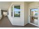 Exterior view of balcony door and wall, showing a building corner and railing system at 7932 Sailboat Key S Blvd # 406, South Pasadena, FL 33707