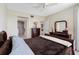 This bedroom features a warm tones and a view into the bathroom at 7932 Sailboat Key S Blvd # 406, South Pasadena, FL 33707
