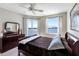 This bedroom features a beautiful view of the water and a ceiling fan at 7932 Sailboat Key S Blvd # 406, South Pasadena, FL 33707