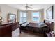 This bedroom features a beautiful view of the water and a ceiling fan at 7932 Sailboat Key S Blvd # 406, South Pasadena, FL 33707