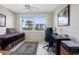 This bedroom features warm tones and desk space at 7932 Sailboat Key S Blvd # 406, South Pasadena, FL 33707