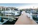 Dock view featuring multiple boats, showcasing waterfront living at 7932 Sailboat Key S Blvd # 406, South Pasadena, FL 33707