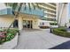 Inviting building entrance with manicured landscaping, showcasing a welcoming and well-maintained property at 7932 Sailboat Key S Blvd # 406, South Pasadena, FL 33707