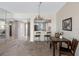 Open dining area with a view to the kitchen and living area, perfect for modern living and entertaining guests at 7932 Sailboat Key S Blvd # 406, South Pasadena, FL 33707