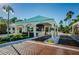 Controlled entry gate provides security and privacy, with lush landscaping and a welcoming presence for residents and visitors at 7932 Sailboat Key S Blvd # 406, South Pasadena, FL 33707
