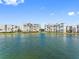 Waterfront condo buildings with manicured lawns, offering serene water views at 7932 Sailboat Key S Blvd # 406, South Pasadena, FL 33707