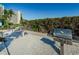 Outdoor grilling area with several stainless steel barbecue grills, perfect for community cookouts at 7932 Sailboat Key S Blvd # 406, South Pasadena, FL 33707