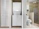 Stacked washer and dryer in closet located next to the bathroom at 7932 Sailboat Key S Blvd # 406, South Pasadena, FL 33707