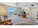 Spacious living room with sliding glass doors to the balcony, offering stunning water views and natural light at 7932 Sailboat Key S Blvd # 406, South Pasadena, FL 33707