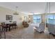 Cozy living room features water view, carpet, and comfortable seating, perfect for relaxation and entertaining at 7932 Sailboat Key S Blvd # 406, South Pasadena, FL 33707