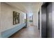 Entry to elevator lobby with bench, artwork, and beautiful natural light at 7932 Sailboat Key S Blvd # 406, South Pasadena, FL 33707
