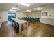 Bright meeting room with flexible seating and a serving counter, perfect for community gatherings at 7932 Sailboat Key S Blvd # 406, South Pasadena, FL 33707