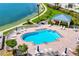This outdoor pool features plenty of lounge chairs for sunbathing and relaxation at 7932 Sailboat Key S Blvd # 406, South Pasadena, FL 33707