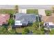 Overhead shot of the house displaying the roof, backyard, and the surrounding properties at 8030 Jasmine Blvd, Port Richey, FL 34668