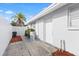 View of side of house featuring a palm tree at 8030 Jasmine Blvd, Port Richey, FL 34668