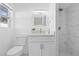 Updated bathroom with modern fixtures and a tiled shower with glass door at 8030 Jasmine Blvd, Port Richey, FL 34668