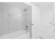 Stylish bathroom featuring a tiled shower and tub combination at 8030 Jasmine Blvd, Port Richey, FL 34668