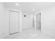 Spacious bedroom with two closets and access to other rooms at 8030 Jasmine Blvd, Port Richey, FL 34668