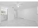 Bright primary bedroom with lots of open space, closet, and adjacent bathroom at 8030 Jasmine Blvd, Port Richey, FL 34668