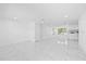 Spacious open-concept living area featuring modern flooring and ample natural light at 8030 Jasmine Blvd, Port Richey, FL 34668
