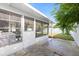 Covered patio with a concrete floor and screen windows at 8030 Jasmine Blvd, Port Richey, FL 34668