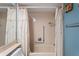 Well-lit bathroom featuring a shower and bathtub combination with decorative curtain and chrome fixtures at 8405 Divot Way, Port Richey, FL 34668