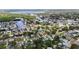 High-angle showcases a charming, tree-lined neighborhood by the calm bay at 9000 Bay Ne St, St Petersburg, FL 33702