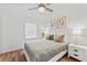 Cozy bedroom with hardwood flooring, a comfortable bed, and natural light from the window at 9000 Bay Ne St, St Petersburg, FL 33702