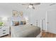 Cozy bedroom with hardwood flooring, a comfortable bed, and natural light from the window at 9000 Bay Ne St, St Petersburg, FL 33702