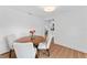Dining room featuring wood floors, round table with seating, and views to an adjacent room at 9000 Bay Ne St, St Petersburg, FL 33702