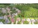 Aerial view of a neighborhood showcasing home with backyard, pool, landscaping, and proximity to a lake at 9813 Woodbay Dr, Tampa, FL 33626