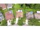 Aerial view of home with screened pool, lush yard and pond at 9813 Woodbay Dr, Tampa, FL 33626