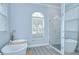 Bright bathroom features a soaking tub next to a glass-enclosed shower with modern fixtures at 9813 Woodbay Dr, Tampa, FL 33626